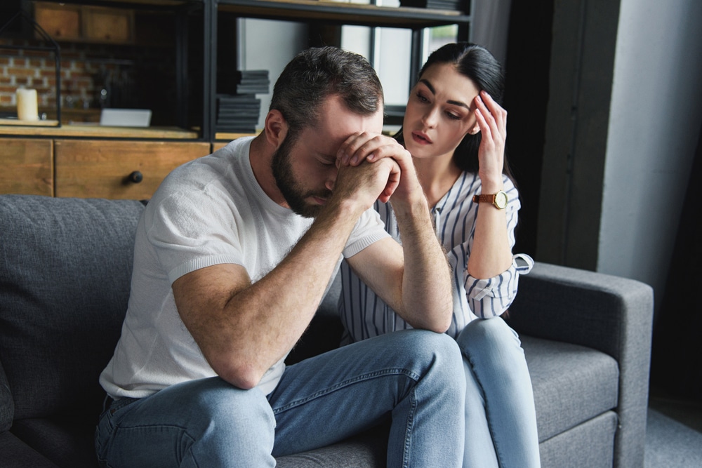 Upset young couple, sad or stressed